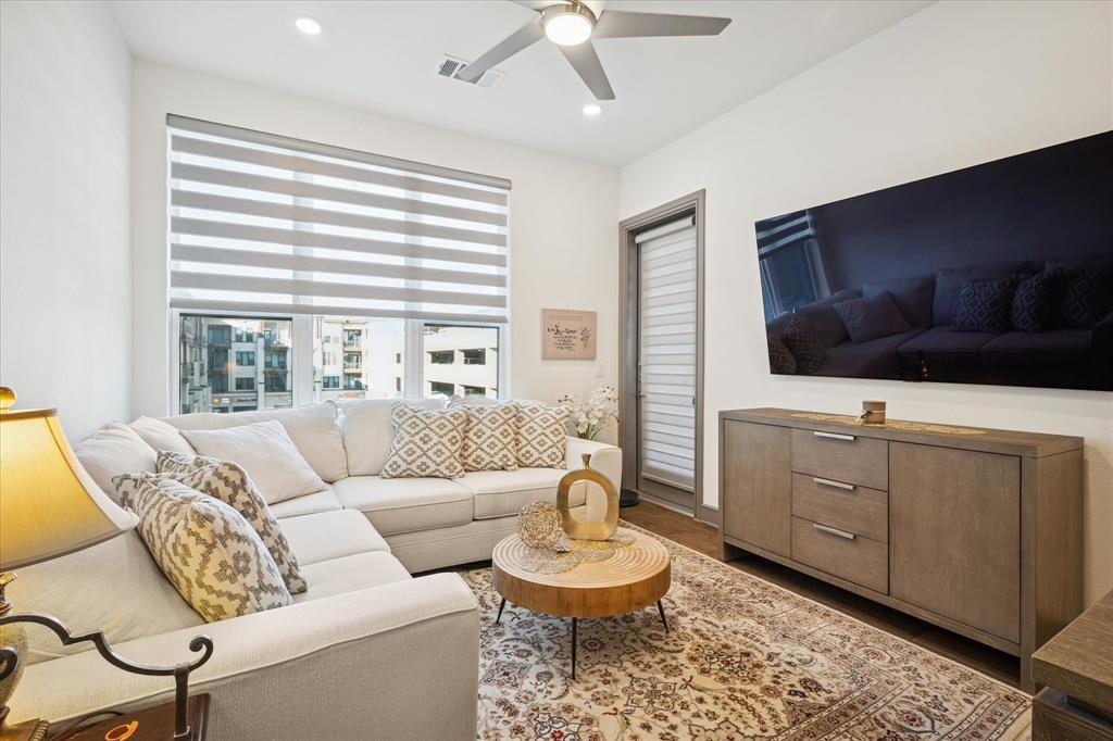 2700 Old Denton Road, Unit 3346 Carrollton, TX 75007 - Photo 9 of 21 a living room with furniture and a flat screen tv