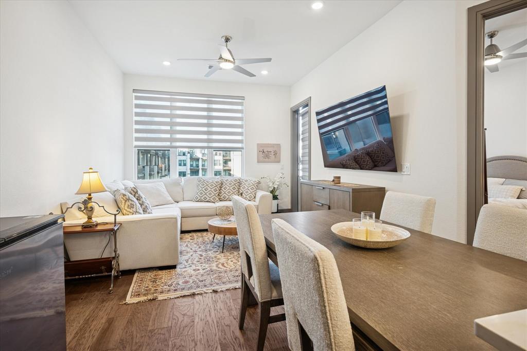 2700 Old Denton Road, Unit 3346 Carrollton, TX 75007 - Photo 10 of 21 a living room with furniture flat screen tv and wooden floor