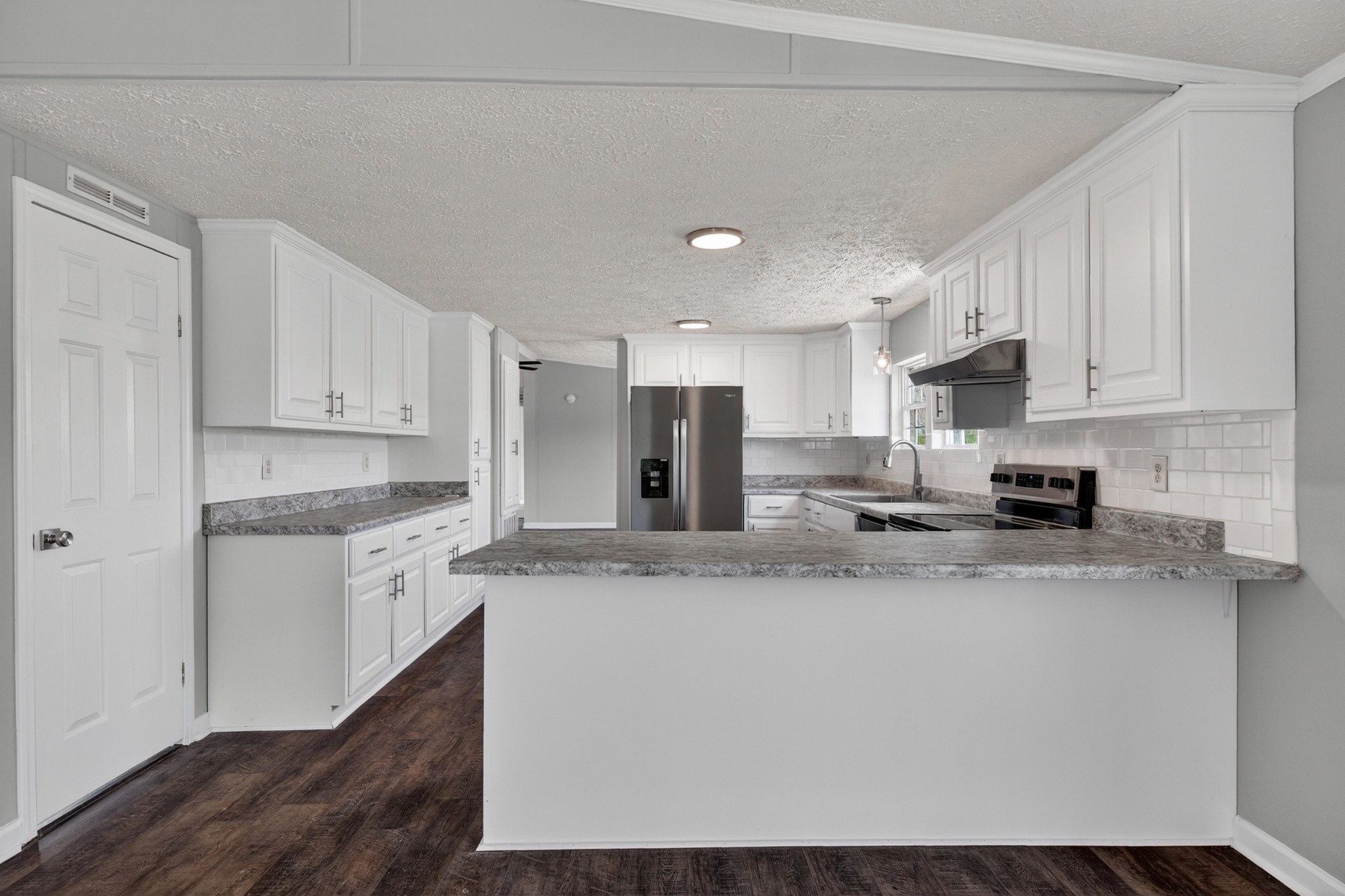 560 Old Huntsville Road Fayetteville, TN 37334 - Photo 13 of 32 a kitchen with stainless steel appliances granite countertop a stove a sink and a refrigerator