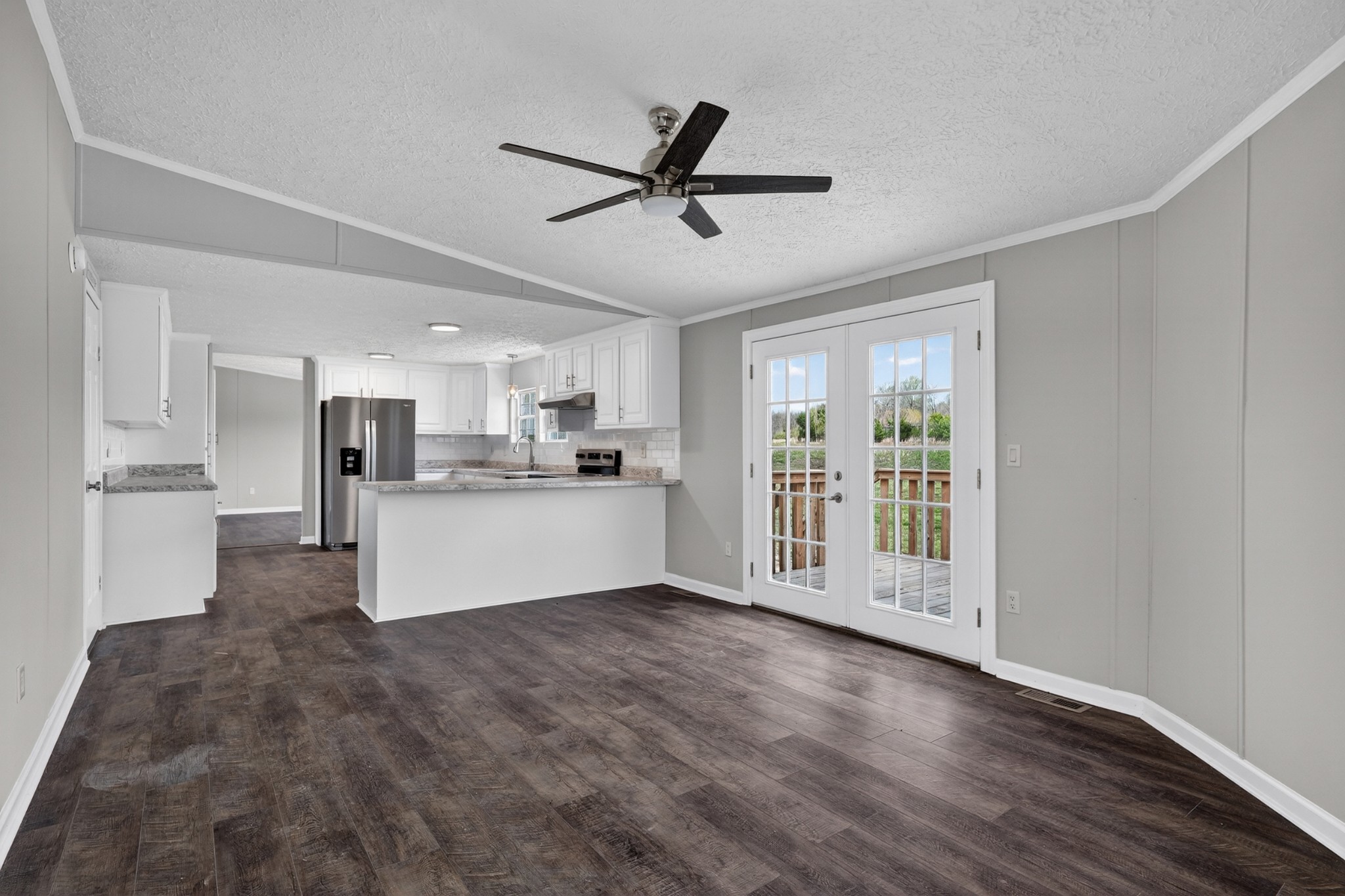 560 Old Huntsville Road Fayetteville, TN 37334 - Photo 14 of 32 a view of open kitchen with wooden floor and window