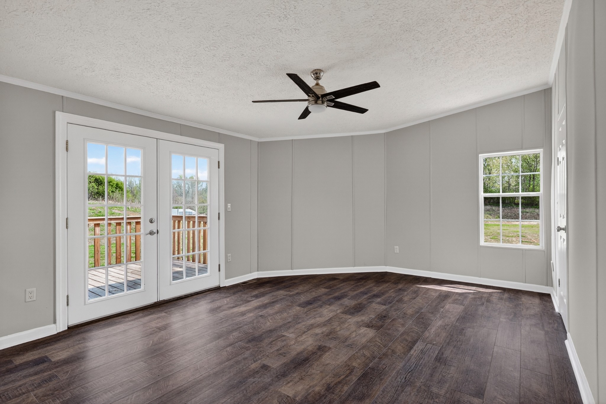 560 Old Huntsville Road Fayetteville, TN 37334 - Photo 15 of 32 an empty room with wooden floor and windows