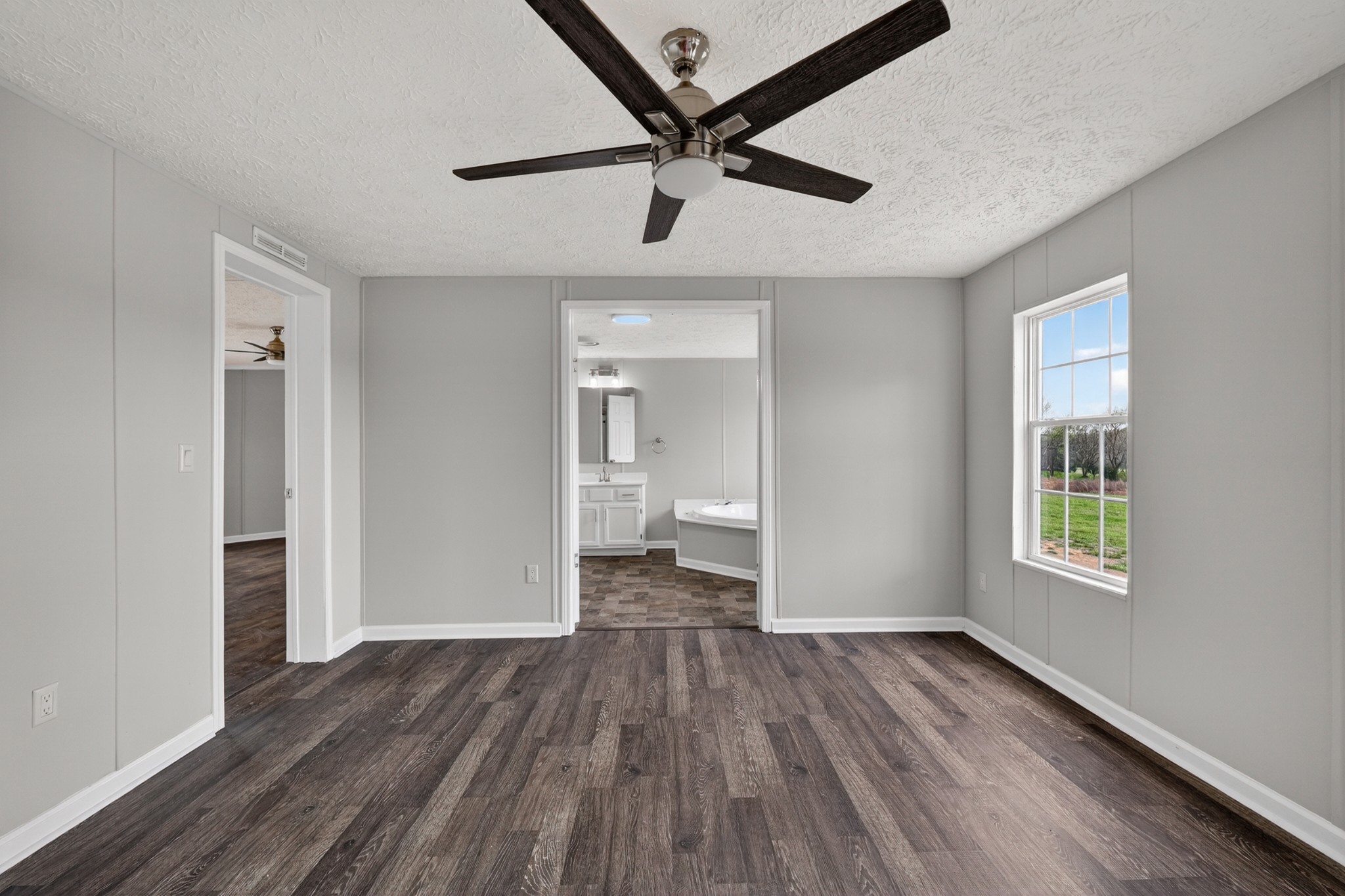 560 Old Huntsville Road Fayetteville, TN 37334 - Photo 16 of 32 wooden floor in an empty room with a window