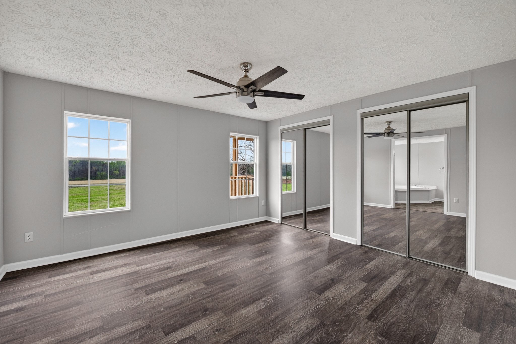 560 Old Huntsville Road Fayetteville, TN 37334 - Photo 17 of 32 a view of an empty room with a window and wooden floor
