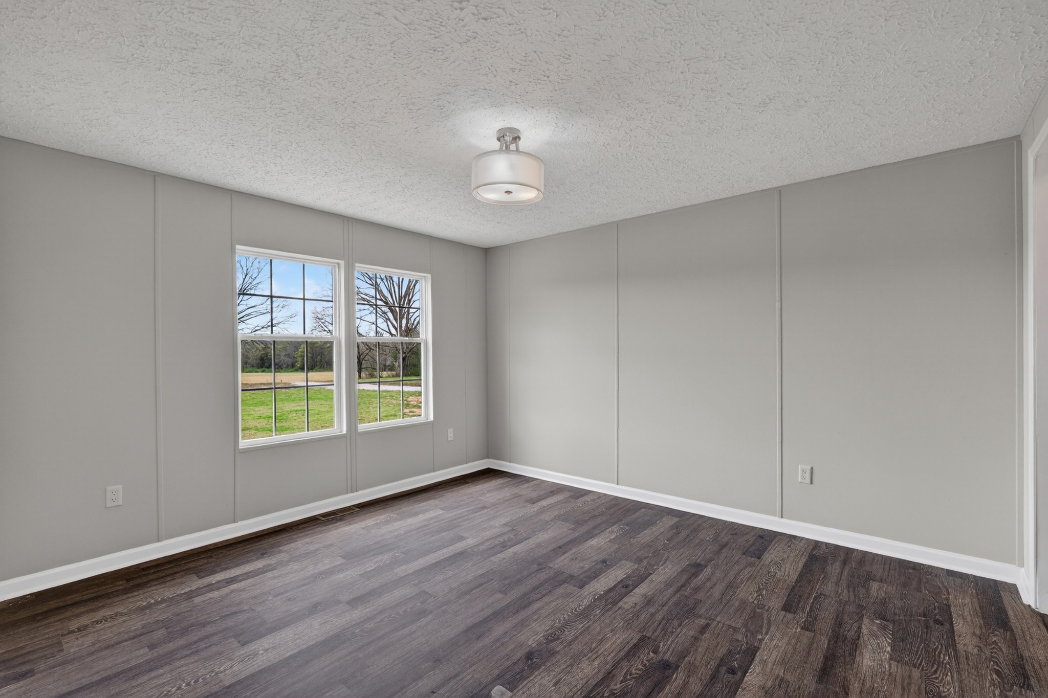 560 Old Huntsville Road Fayetteville, TN 37334 - Photo 21 of 32 a view of an empty room with wooden floor and a window
