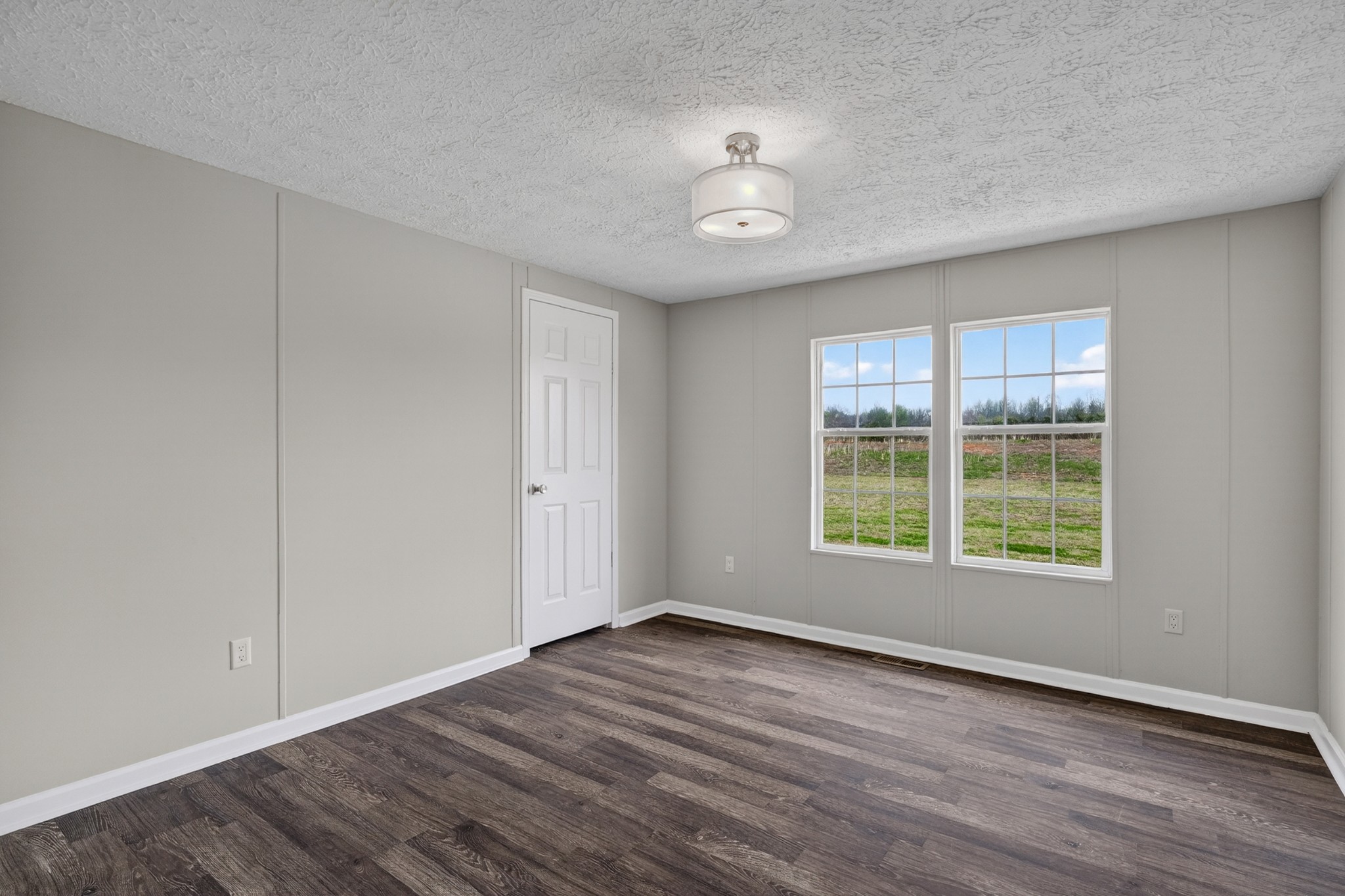 560 Old Huntsville Road Fayetteville, TN 37334 - Photo 23 of 32 a view of an empty room with wooden floor and a window