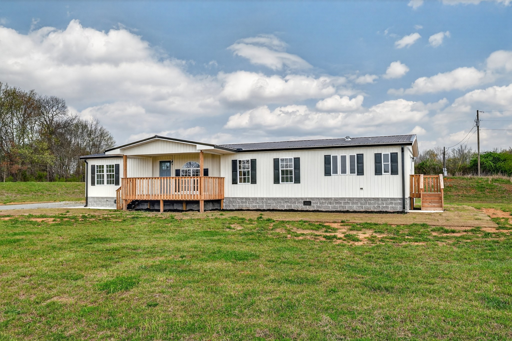 560 Old Huntsville Road Fayetteville, TN 37334 - Photo 25 of 32 a view of a house with a big yard and large trees