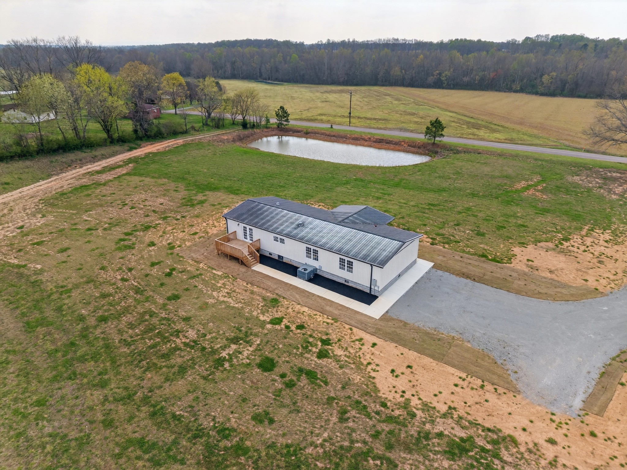 560 Old Huntsville Road Fayetteville, TN 37334 - Photo 29 of 32 a view of a lake with a yard and a mountain view