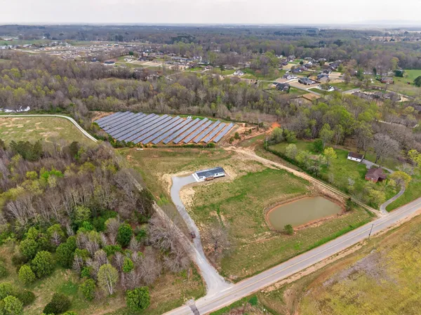 a view of a pool with a yard