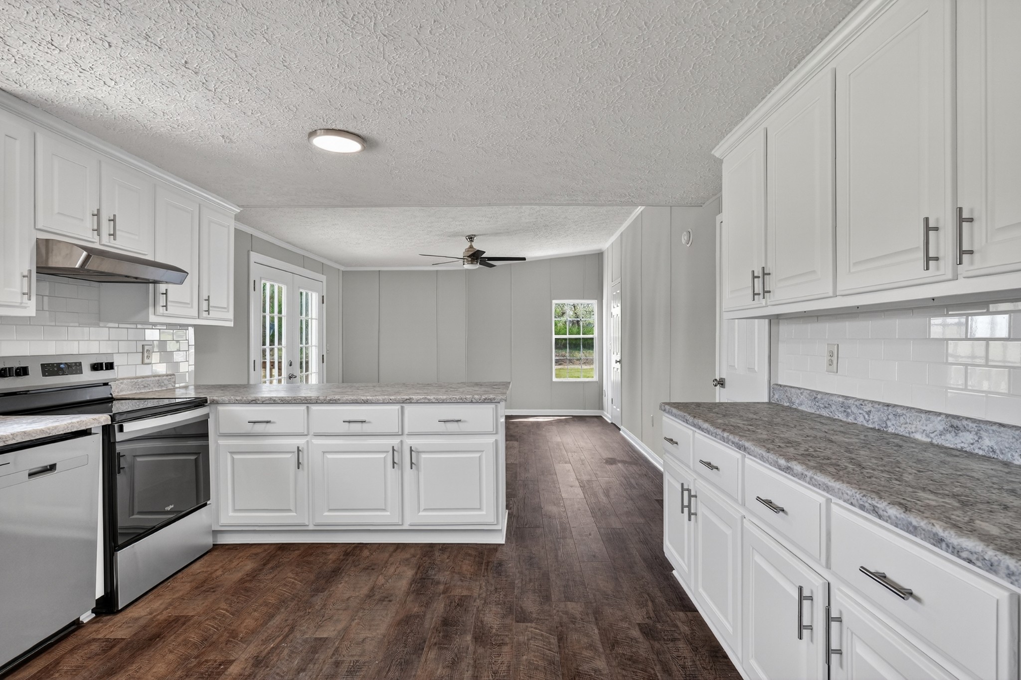 560 Old Huntsville Road Fayetteville, TN 37334 - Photo 9 of 32 a kitchen with granite countertop white cabinets and white appliances