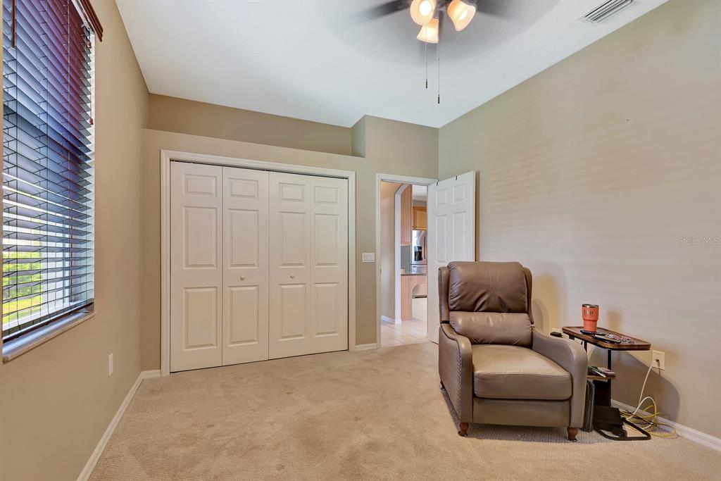 7344 Arrowhead Run Lakewood Ranch, FL 34202 - Photo 16 of 24 a living room with furniture and a window