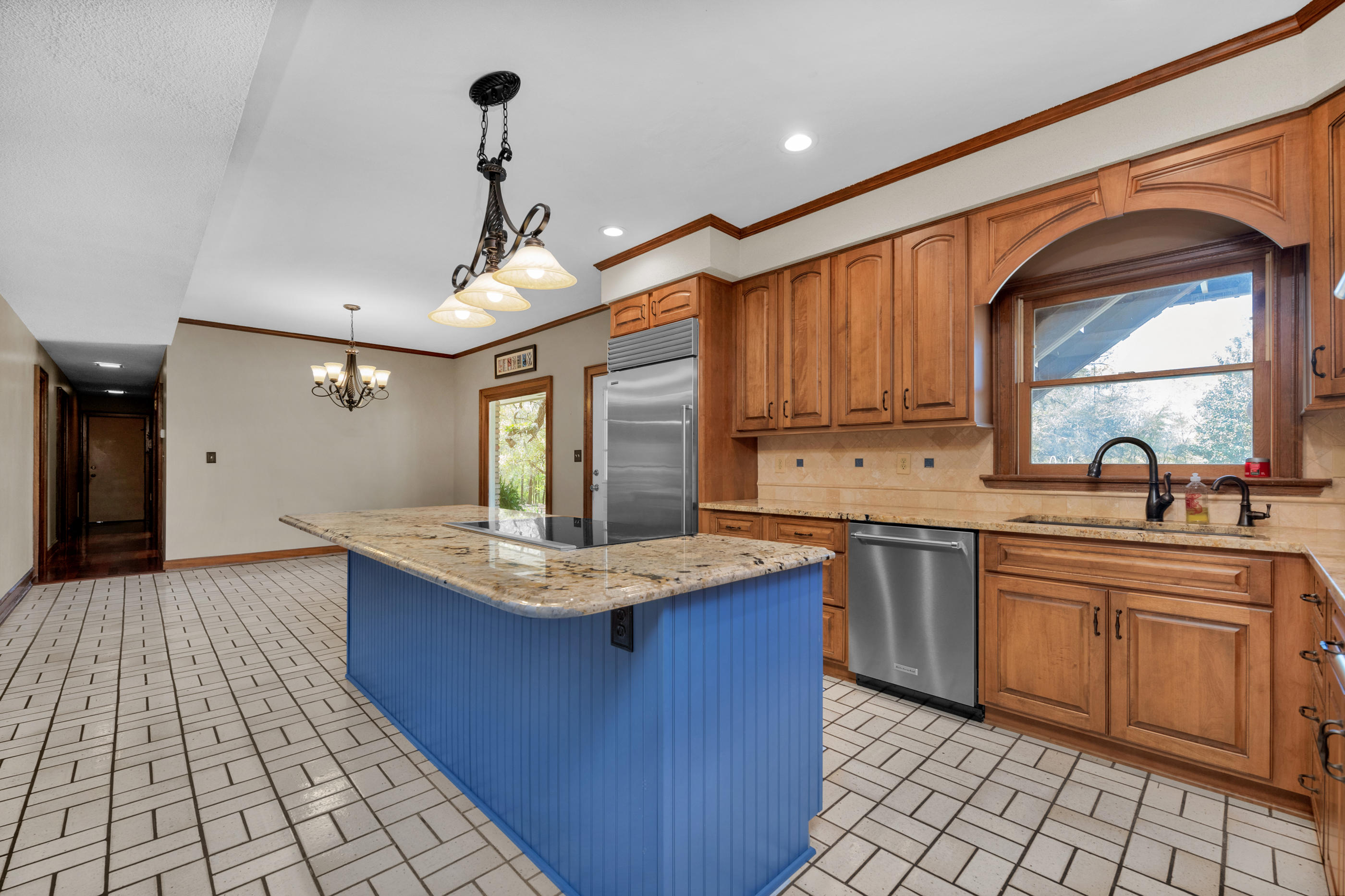 1 Lindley Road Crestview, FL 32536 - Photo 30 of 80 a kitchen with granite countertop a sink stove and cabinets
