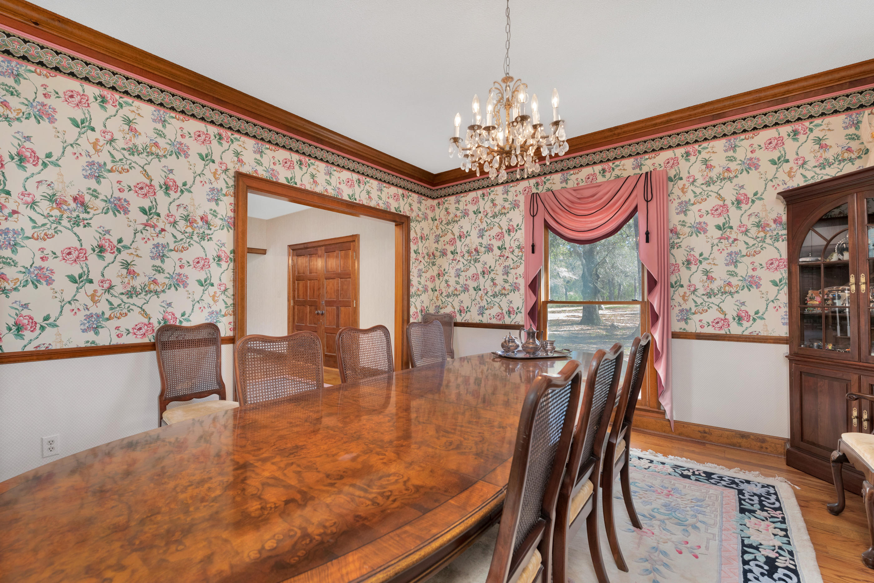 1 Lindley Road Crestview, FL 32536 - Photo 31 of 80 a dining room with furniture a chandelier and wooden floor