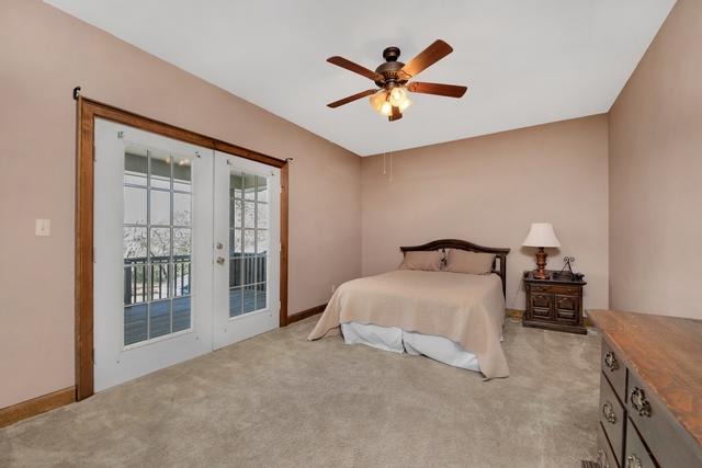 1 Lindley Road Crestview, FL 32536 - Photo 39 of 80 a bedroom with a large bed and a chandelier