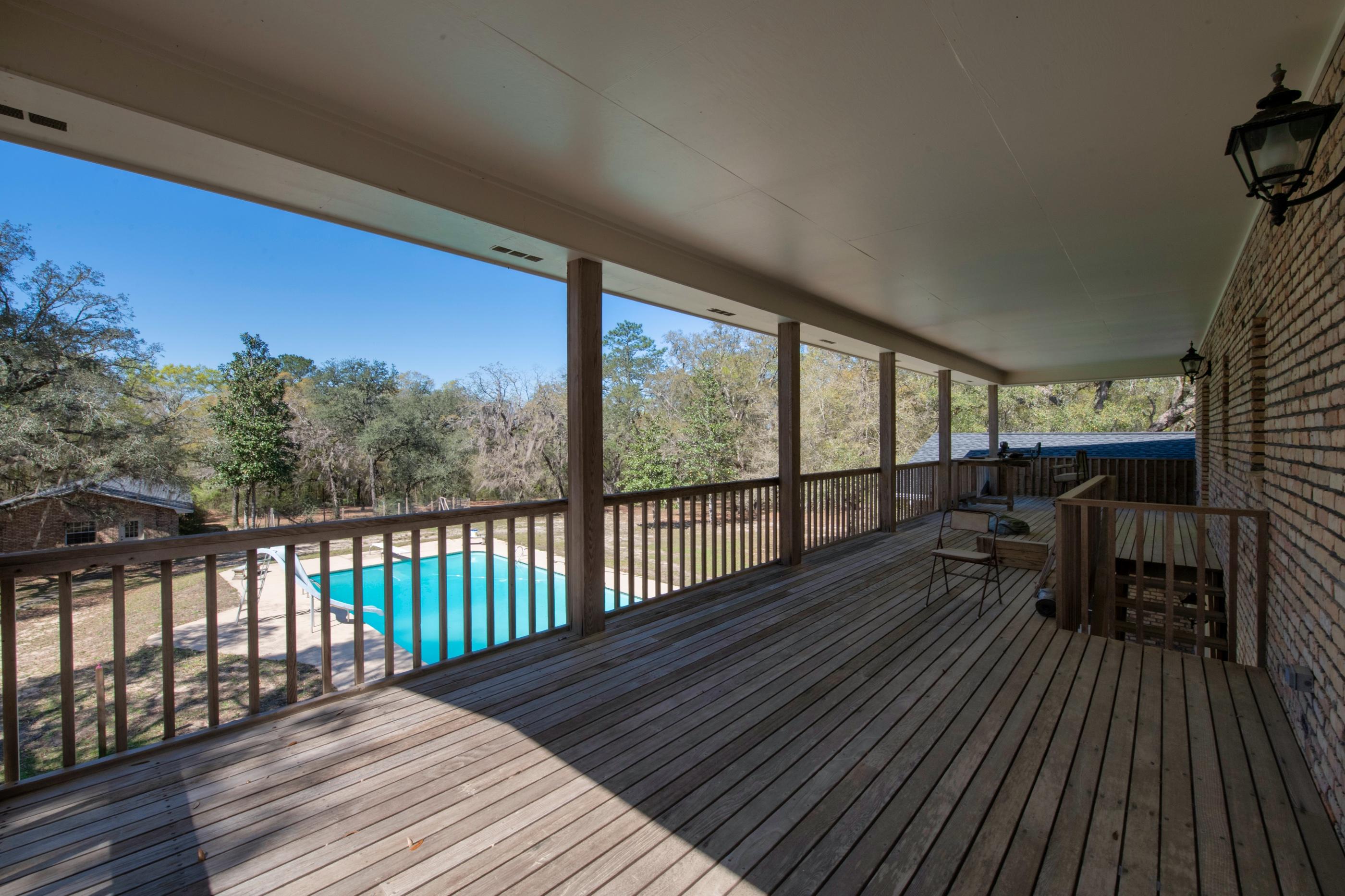 1 Lindley Road Crestview, FL 32536 - Photo 48 of 80 a view of balcony with wooden floor and seating space