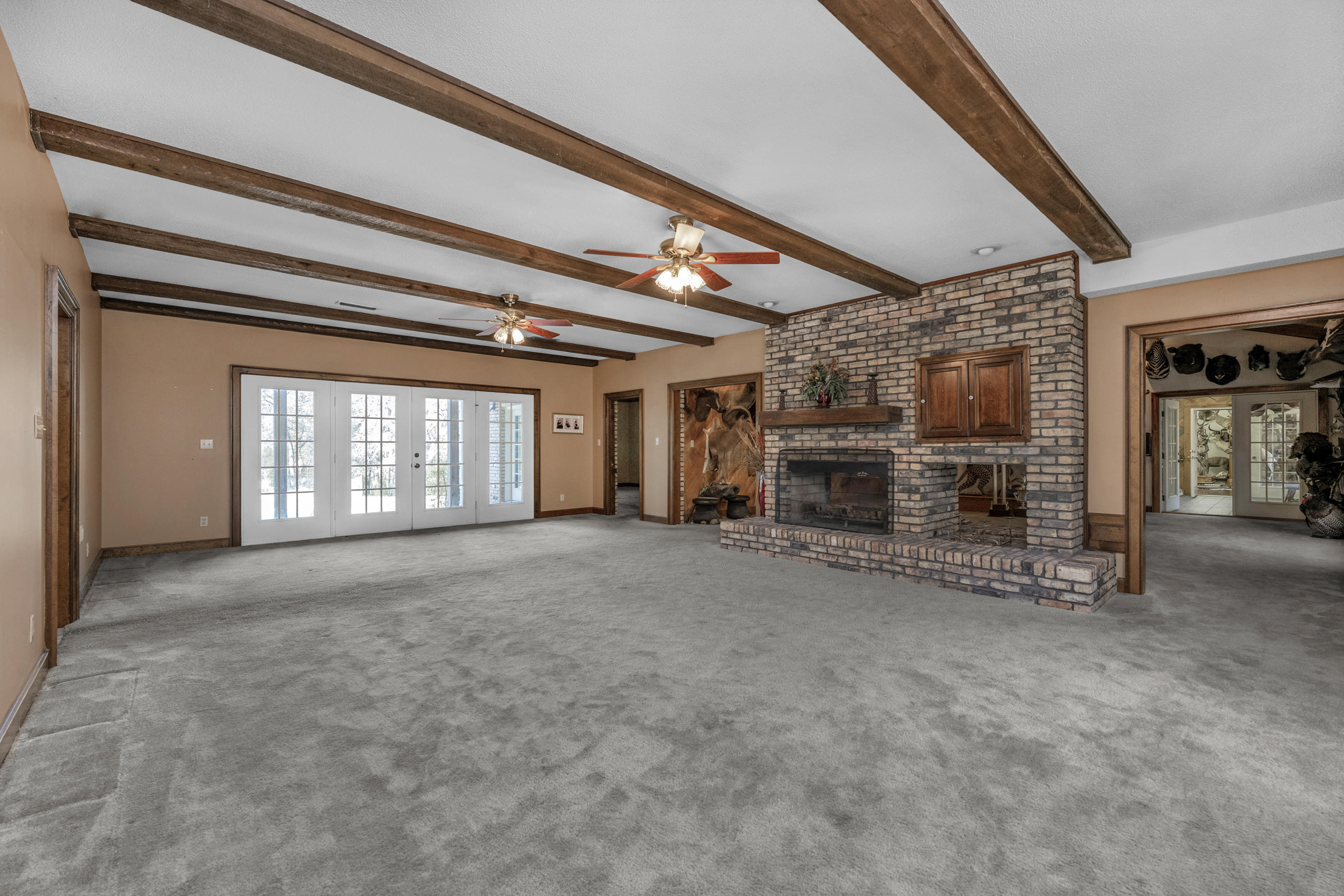 1 Lindley Road Crestview, FL 32536 - Photo 6 of 80 a view of an empty room with a fireplace and a window