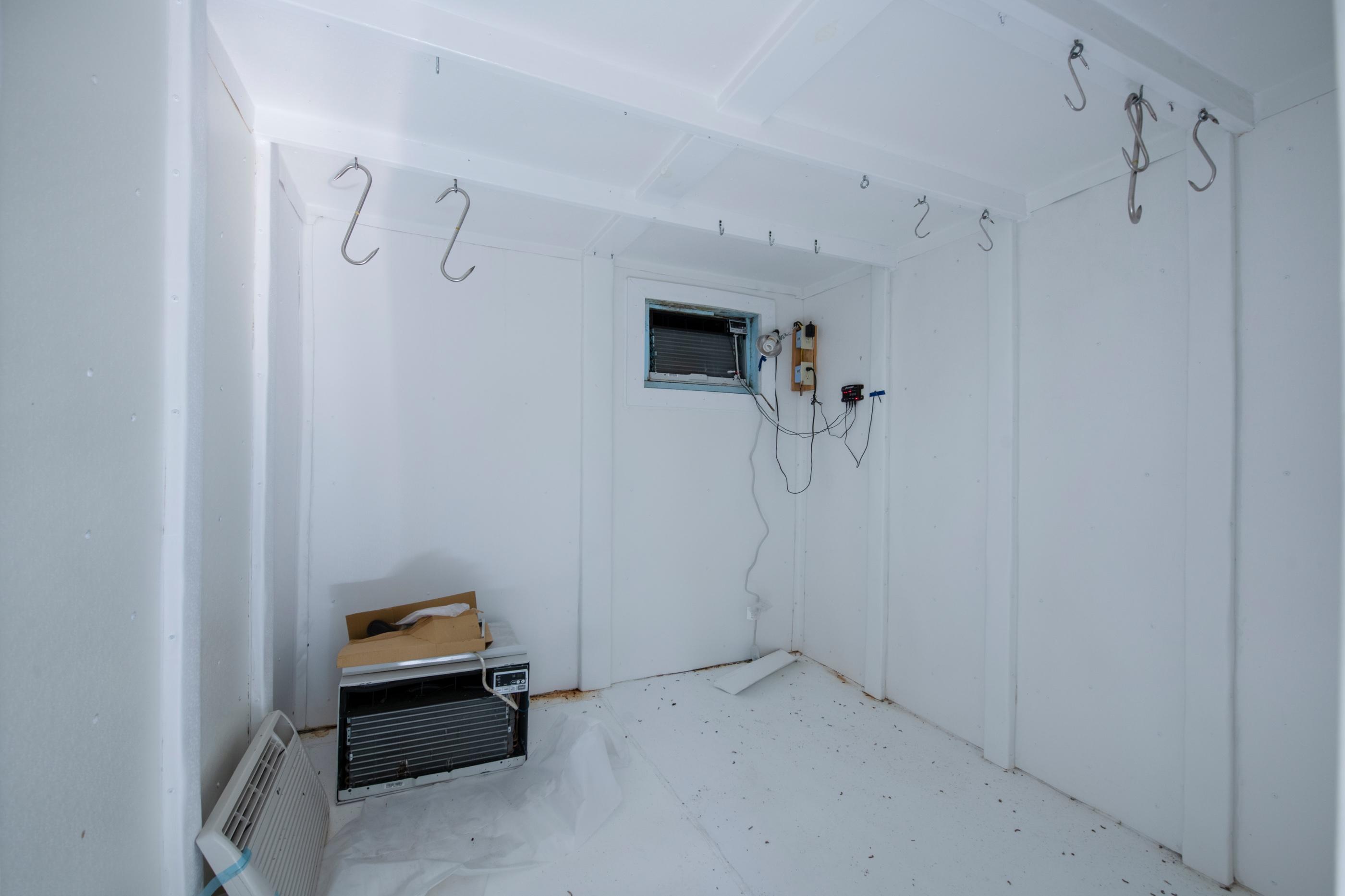 1 Lindley Road Crestview, FL 32536 - Photo 61 of 80 a view of storage and utility room with racks on the wall