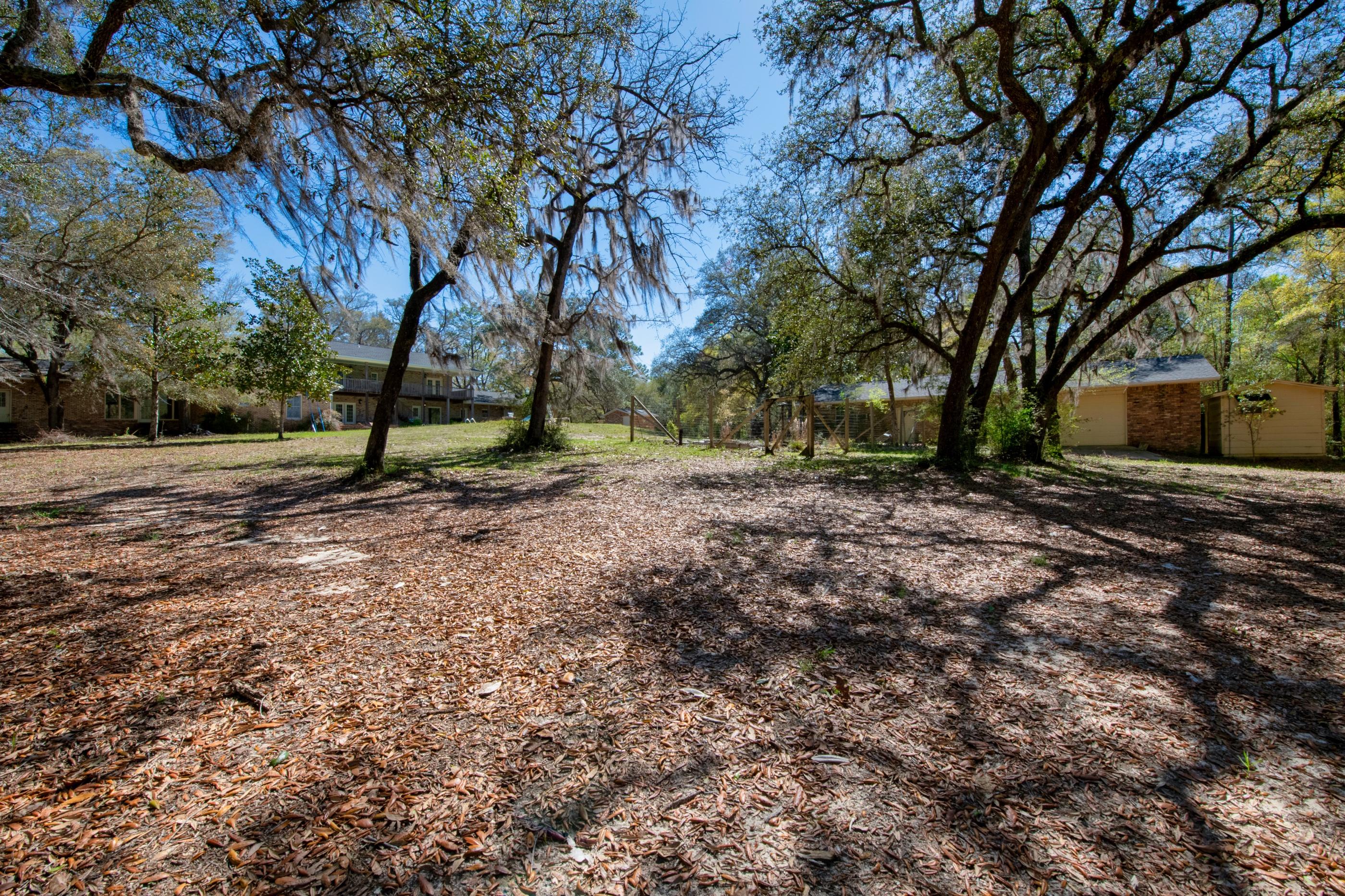 1 Lindley Road Crestview, FL 32536 - Photo 65 of 80 a view of a backyard with large trees