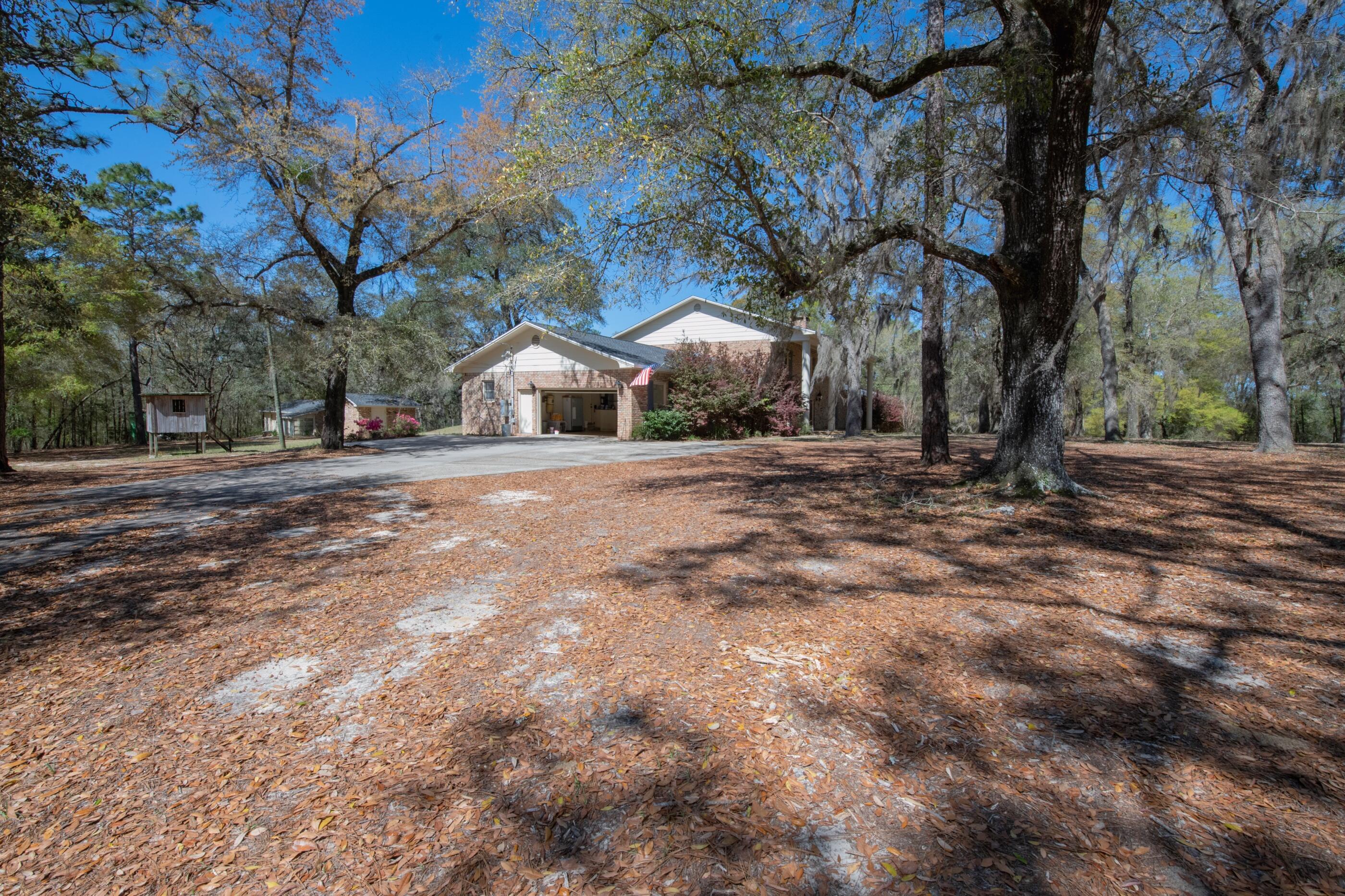 1 Lindley Road Crestview, FL 32536 - Photo 77 of 80 a view of a yard with a tree