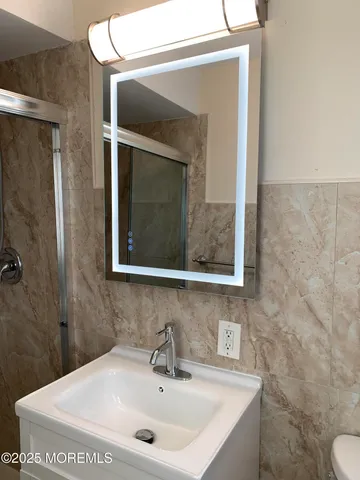 a bathroom with a sink and a mirror