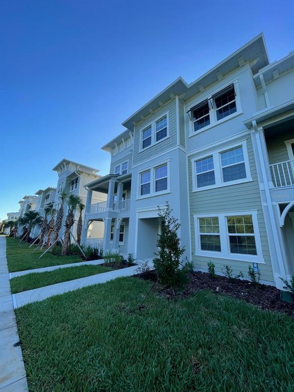 3477 Wildflower Vly Lane Wesley Chapel, FL 33543 - Photo 16 of 38 a front view of a house with a garden