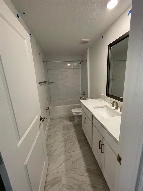 3477 Wildflower Vly Lane Wesley Chapel, FL 33543 - Photo 21 of 38 a spacious bathroom with a double vanity sink a mirror and a bathtub