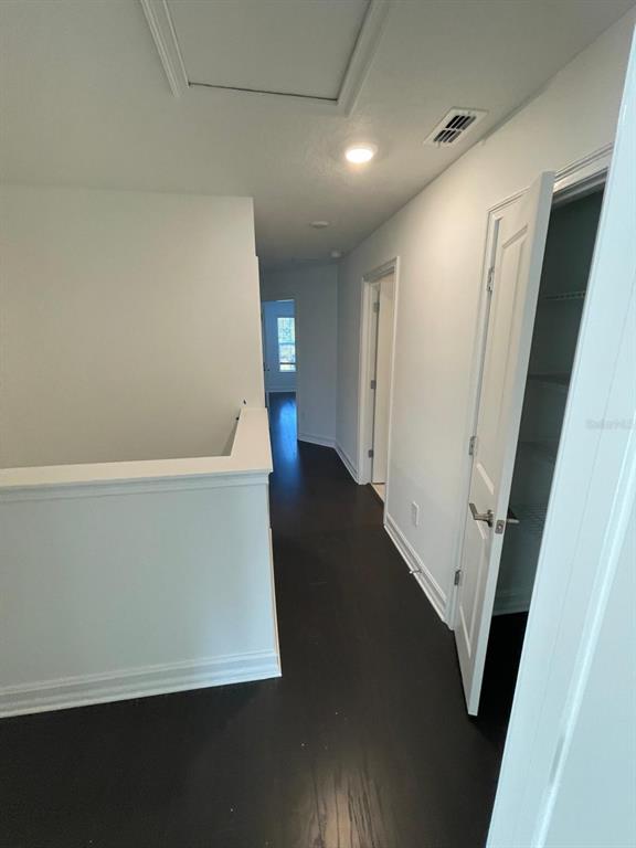 3477 Wildflower Vly Lane Wesley Chapel, FL 33543 - Photo 22 of 38 a view of an empty room with wooden floor