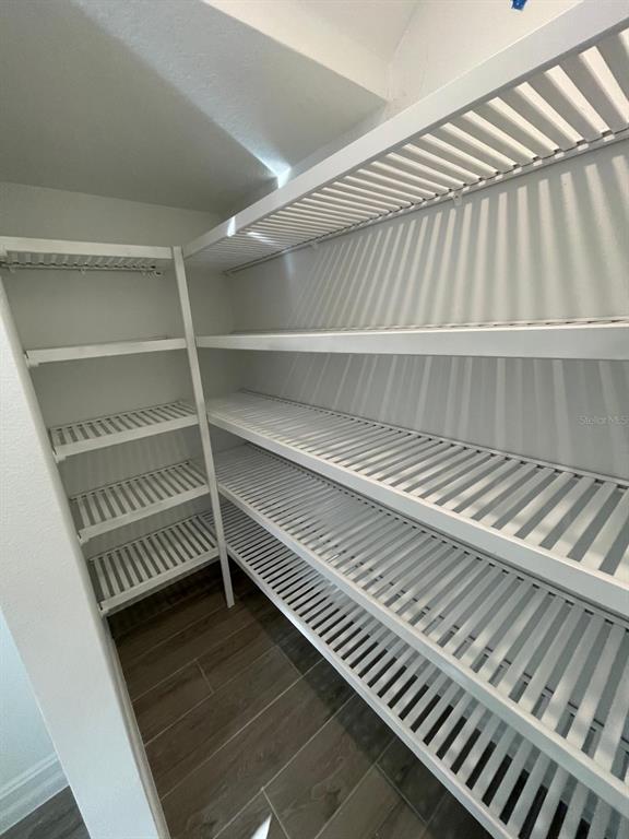 3477 Wildflower Vly Lane Wesley Chapel, FL 33543 - Photo 28 of 38 a view of a room with wooden floor