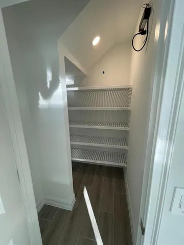 a view of staircase with white walls