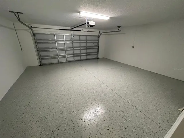 a bathroom with a glass door shower