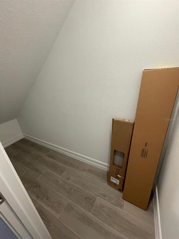 3477 Wildflower Vly Lane Wesley Chapel, FL 33543 - Photo 34 of 38 a view of a room with wooden floor and chair