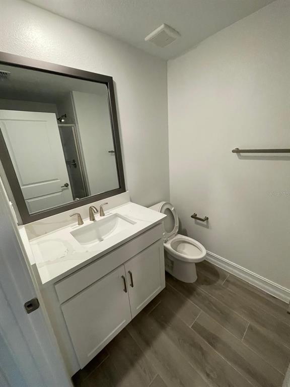 3477 Wildflower Vly Lane Wesley Chapel, FL 33543 - Photo 36 of 38 a bathroom with a double vanity sink and a mirror