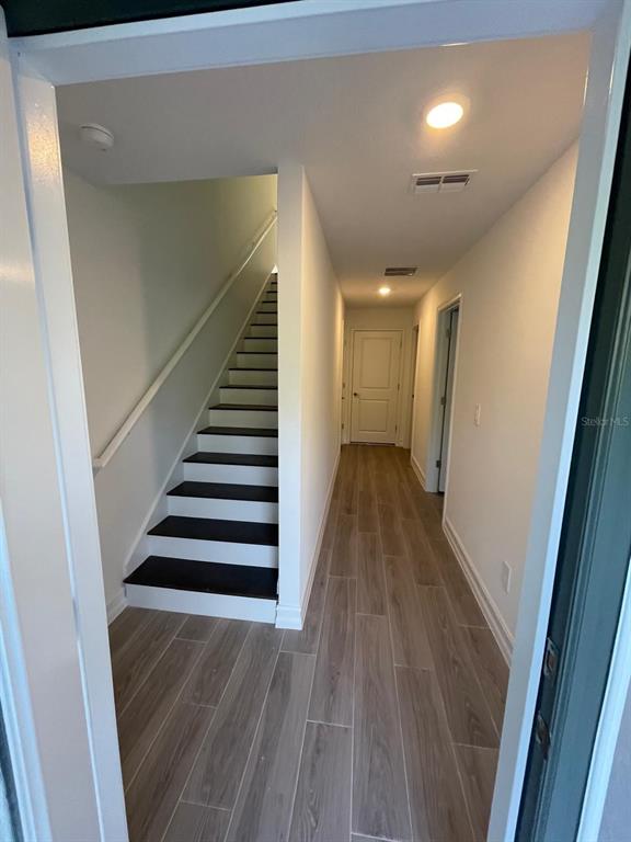 3477 Wildflower Vly Lane Wesley Chapel, FL 33543 - Photo 38 of 38 a view of a hallway with wooden floor and entryway