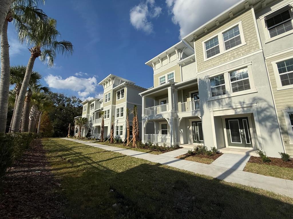 3477 Wildflower Vly Lane Wesley Chapel, FL 33543 - Photo 5 of 38 a view of a building with a yard