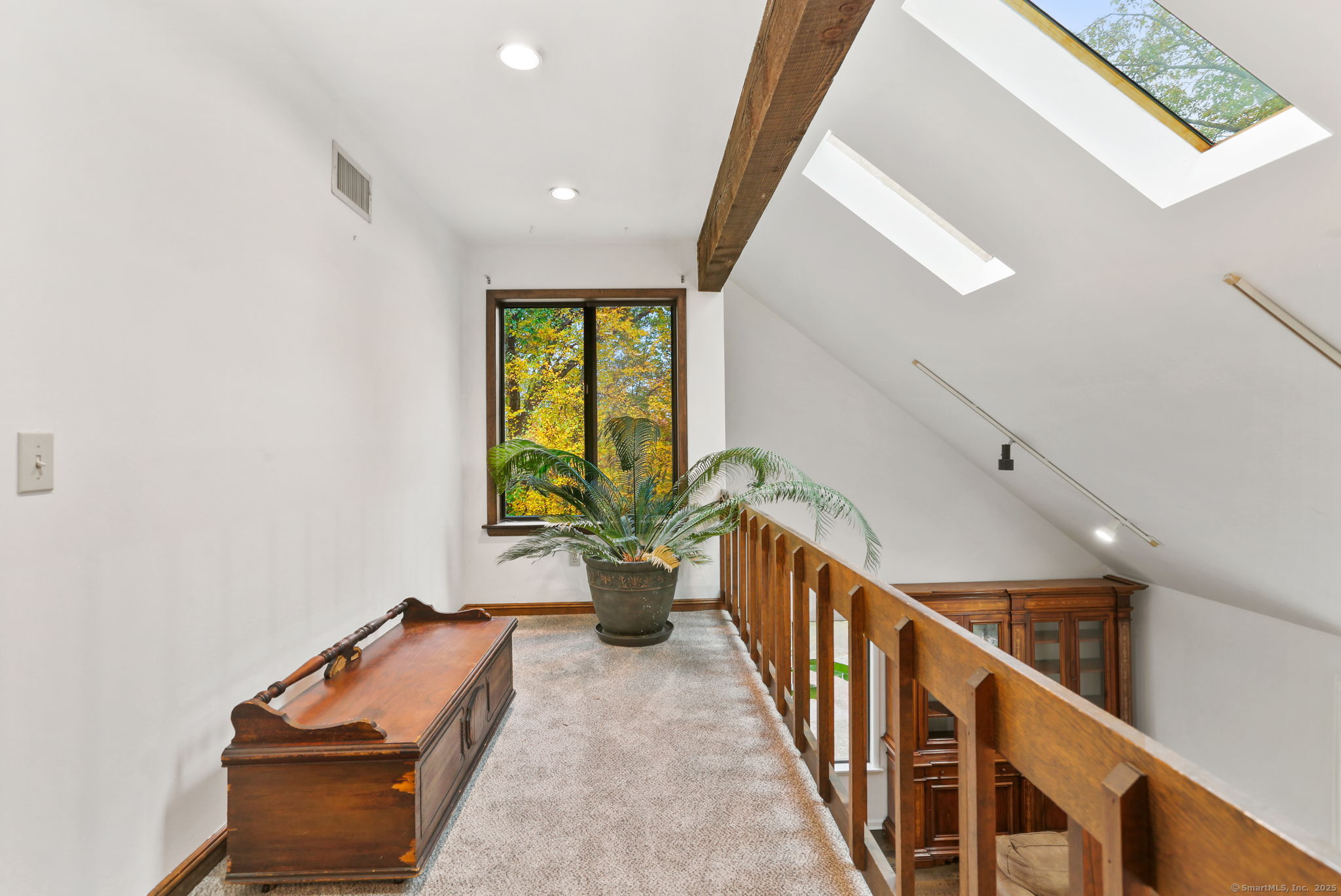 22 Ledgewood Road Redding, CT 06896 - Photo 12 of 18 a hallway with wooden floor and furniture