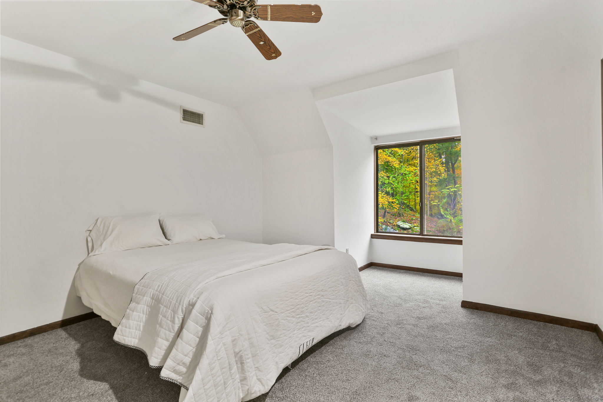 22 Ledgewood Road Redding, CT 06896 - Photo 14 of 18 a spacious bedroom with a bed and a window