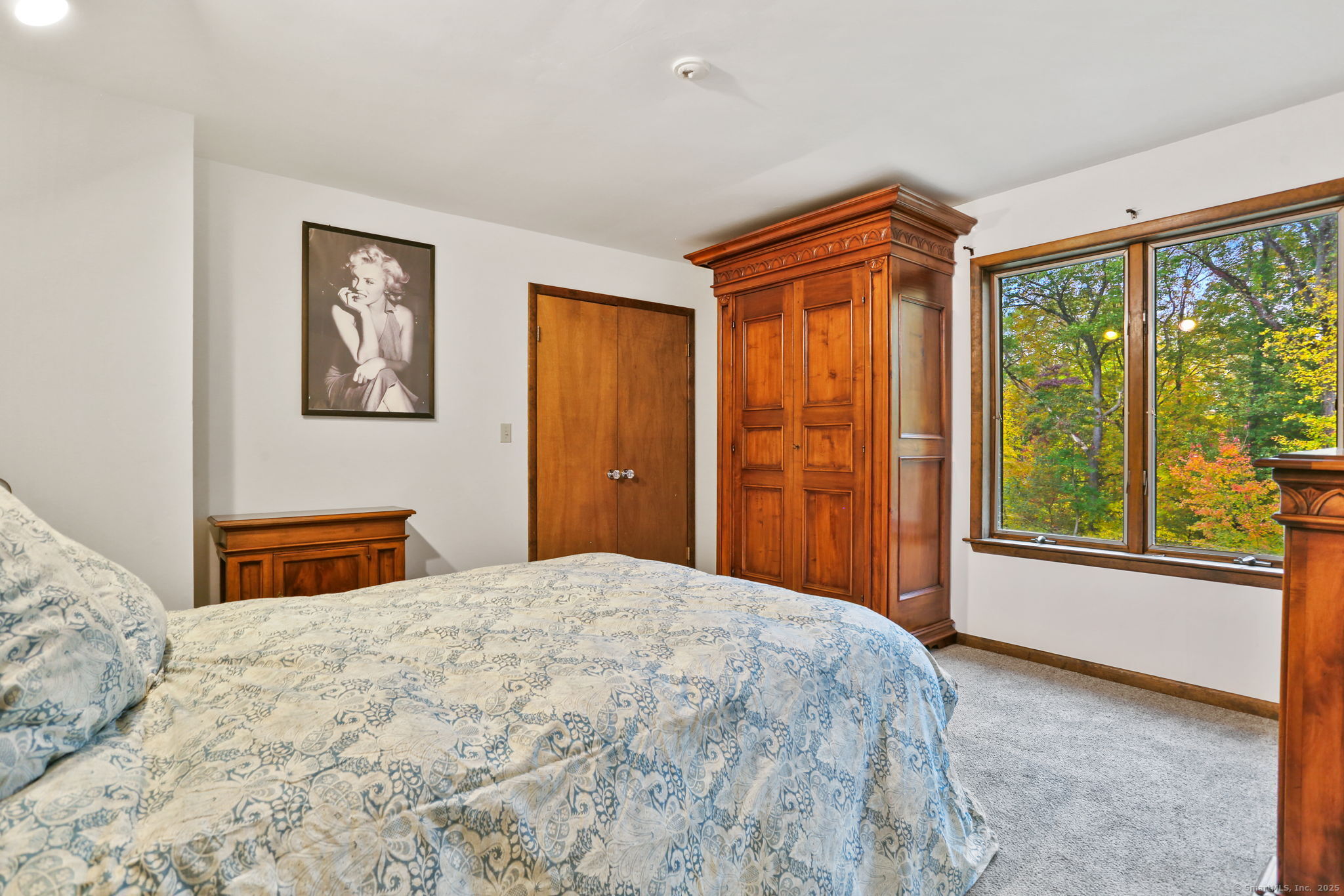 22 Ledgewood Road Redding, CT 06896 - Photo 17 of 18 a bedroom with a large bed and a window