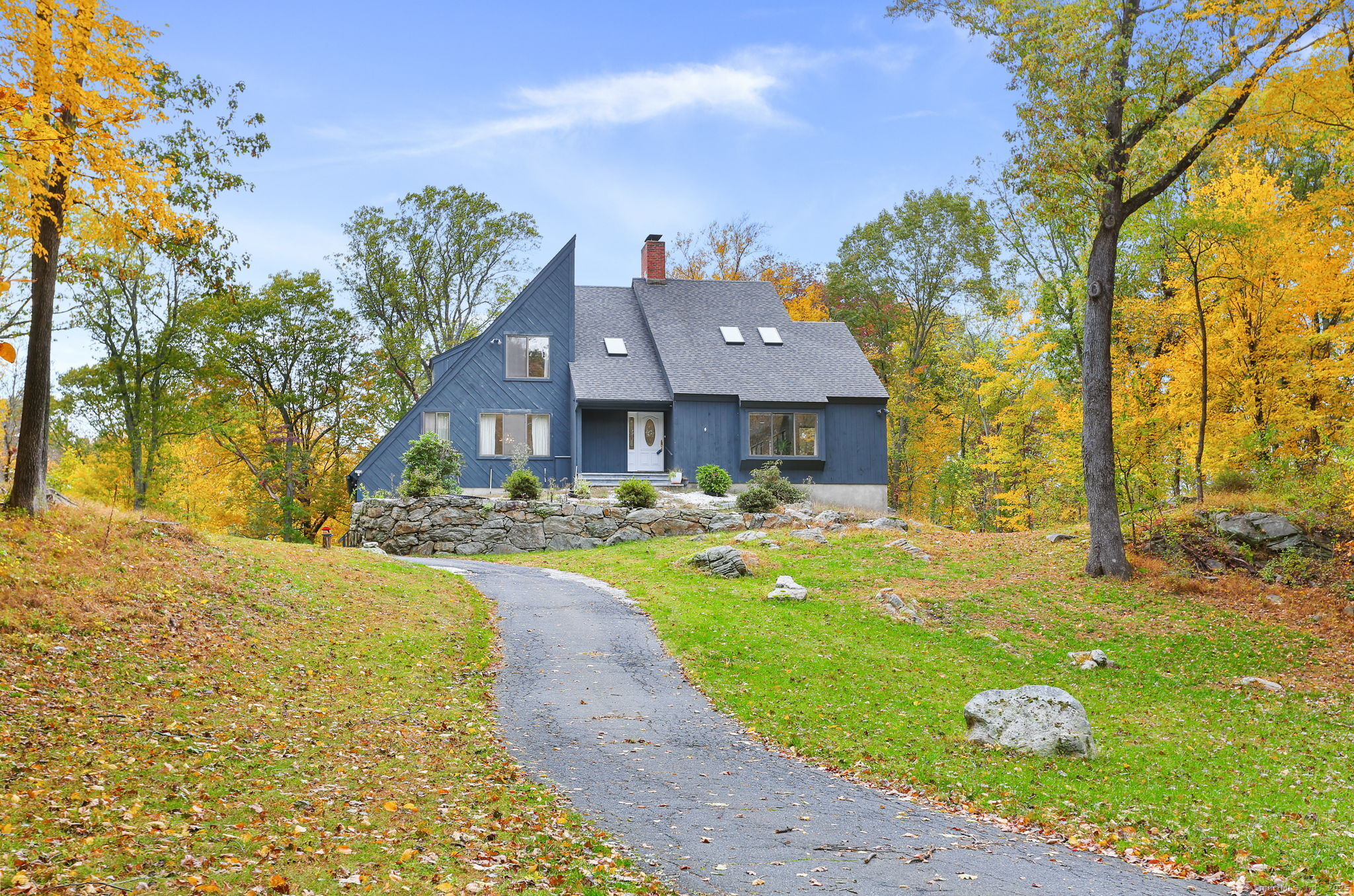 22 Ledgewood Road Redding, CT 06896 - Photo 2 of 18 a view of a house with backyard and sitting area