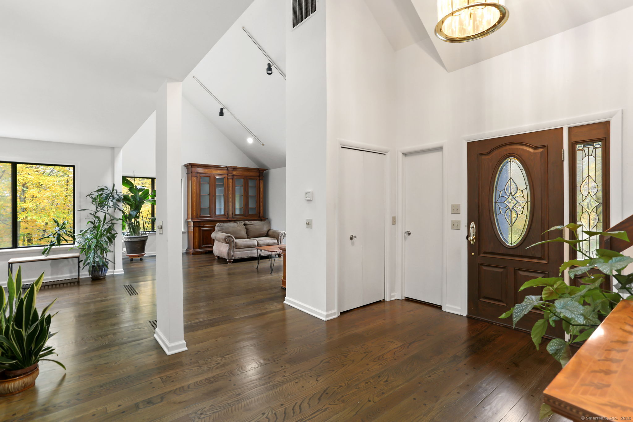 22 Ledgewood Road Redding, CT 06896 - Photo 5 of 18 a living room with fireplace furniture and a wooden floor