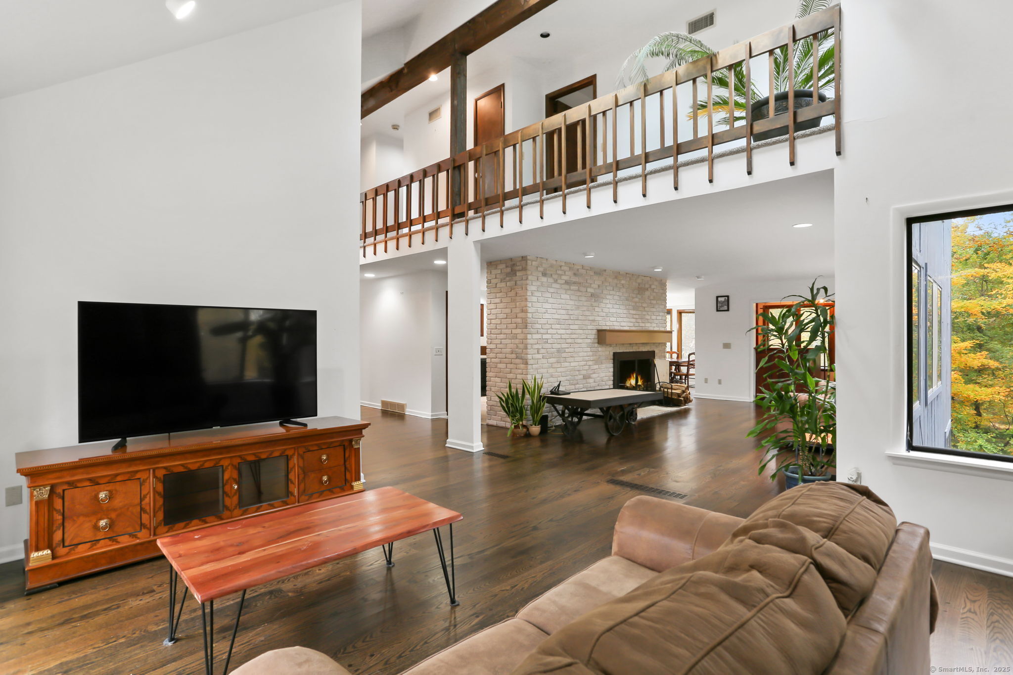 22 Ledgewood Road Redding, CT 06896 - Photo 6 of 18 a living room with furniture and a flat screen tv