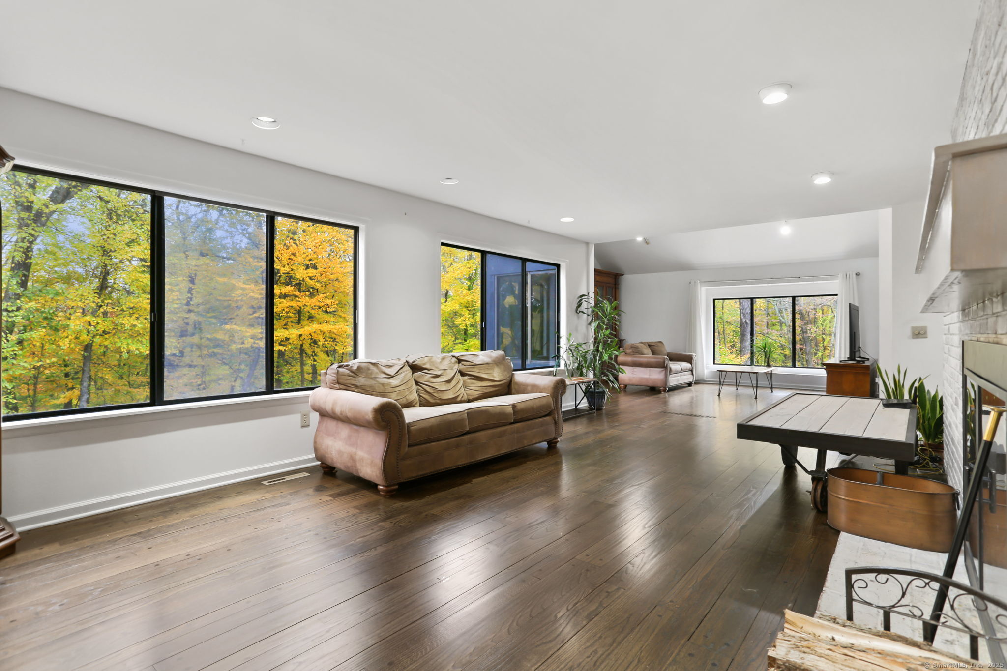 22 Ledgewood Road Redding, CT 06896 - Photo 7 of 18 a living room with fireplace furniture and a large window