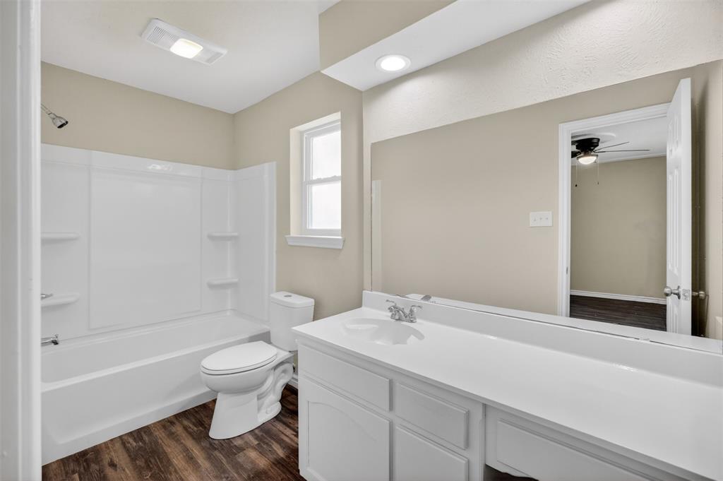7528 Meadowlark Lane North Watauga, TX 76148 - Photo 24 of 31 a bathroom with a sink toilet and shower