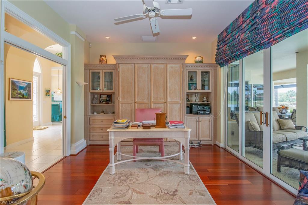 20128 Cheetah Lane Estero, FL 33928 - Photo 11 of 30 a work space with wooden floor and furniture