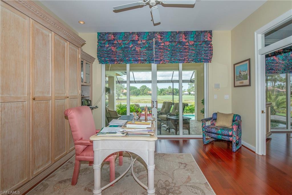 20128 Cheetah Lane Estero, FL 33928 - Photo 12 of 30 a dining room with furniture and wooden floor