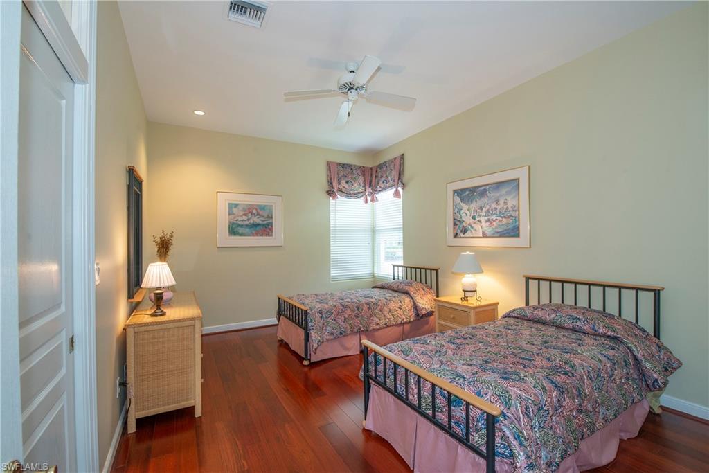 20128 Cheetah Lane Estero, FL 33928 - Photo 19 of 30 a bedroom with bed and wooden floor