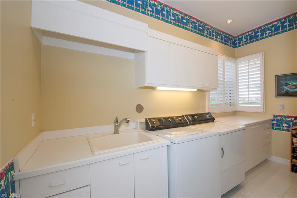 20128 Cheetah Lane Estero, FL 33928 - Photo 23 of 30 a room with storage and utility