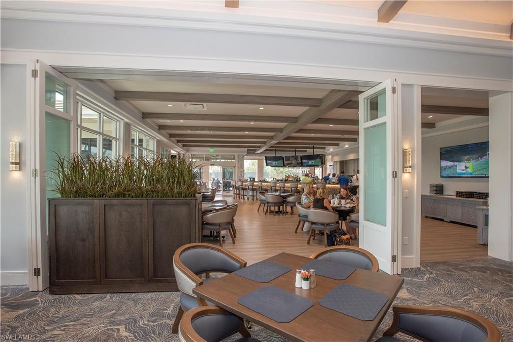 20128 Cheetah Lane Estero, FL 33928 - Photo 28 of 30 a dining room with furniture and a chandelier