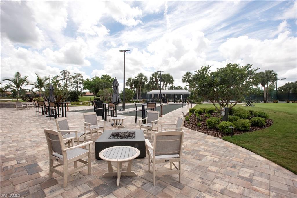 20128 Cheetah Lane Estero, FL 33928 - Photo 29 of 30 a view of a terrace with furniture and garden