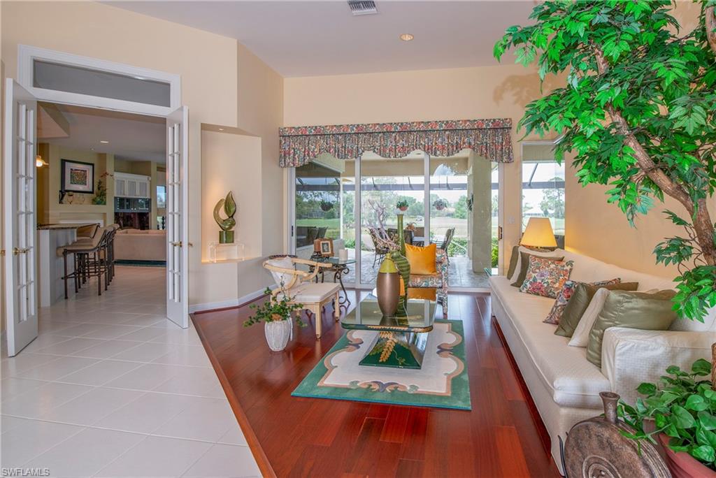 20128 Cheetah Lane Estero, FL 33928 - Photo 6 of 30 an outdoor dining space with furniture