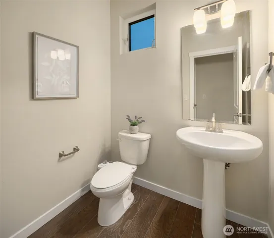 a bedroom with a bed and a sink