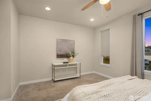 a bathroom with a sink toilet vanity and shower